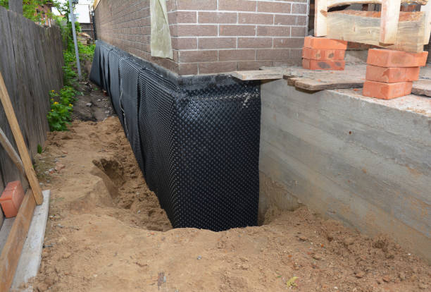 SJ Waterproofing Pros technician performing targeted Waterproofing assessment in Knightstown, IN